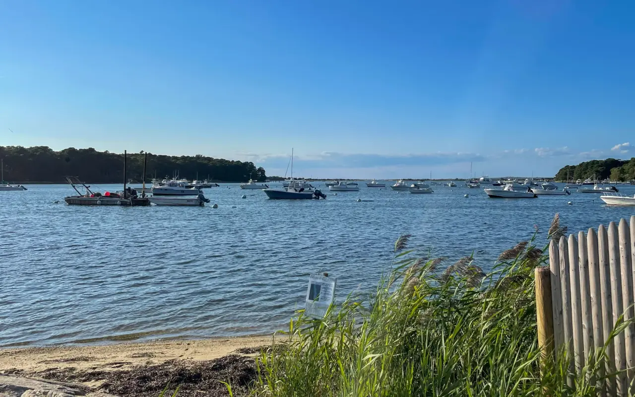 Boats moored on the calm water of Lake Tashmoo in Vineyard Haven
