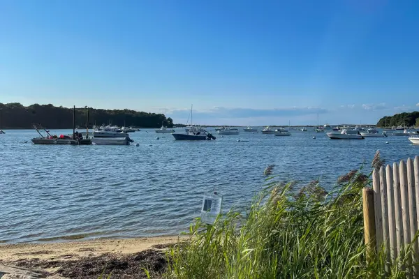 Boats moored on Lake Tashmoo on a summer day