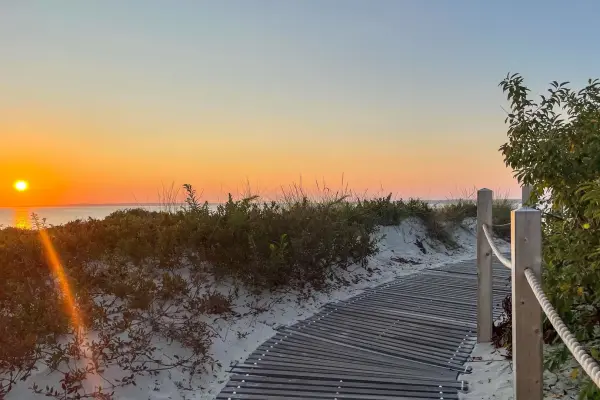 Sunset over the dunes from the Lamberts Cove beach boardwalk