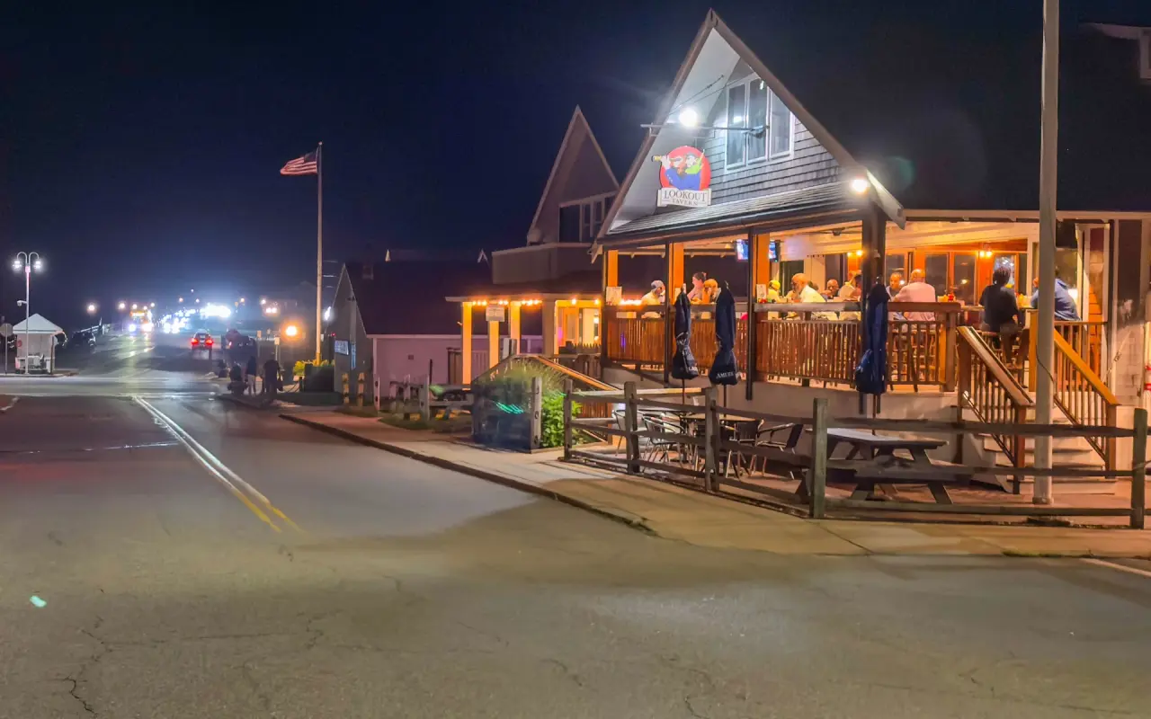 Lookout Tavern porch lit at night on Seaview Avenue in Oak Bluffs