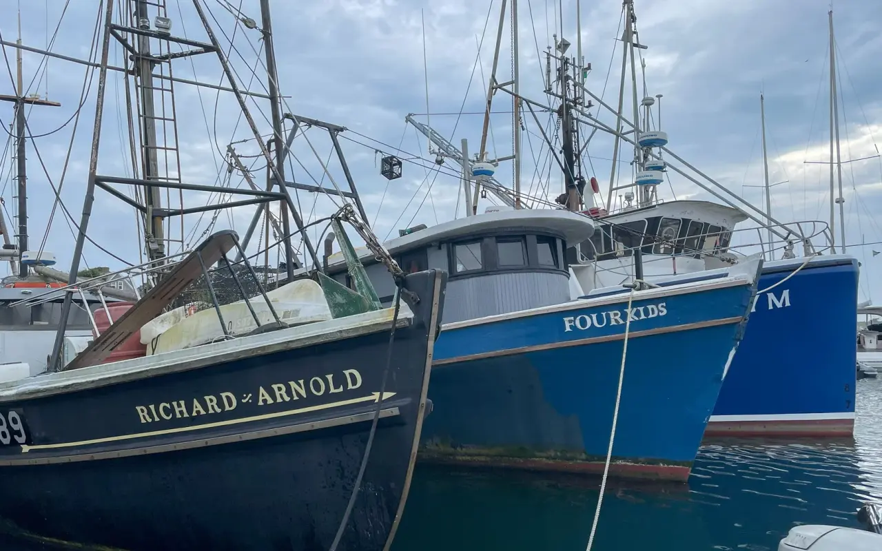 The fishing boats Richard and Arnold and Four Kids rafted at the Menemsha dock