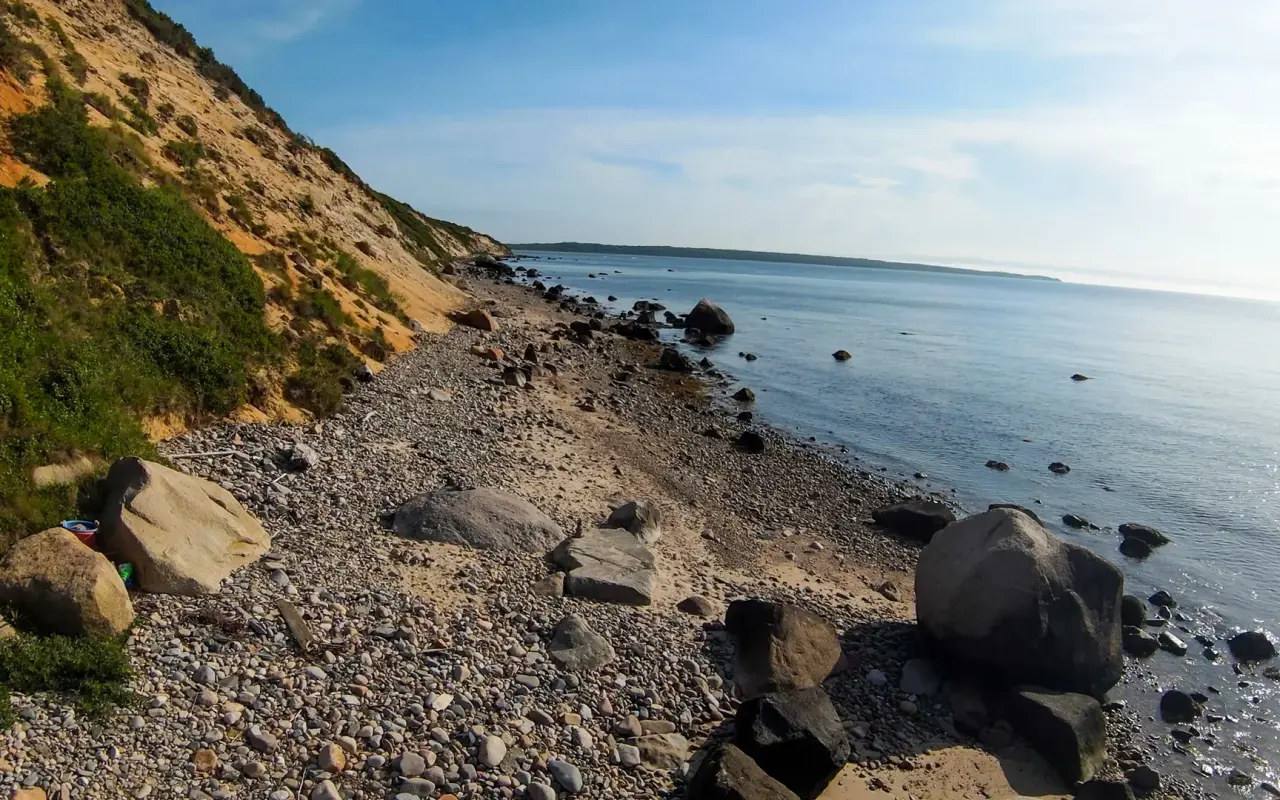 Rocky beach and clay bluff below Menemsha Hills