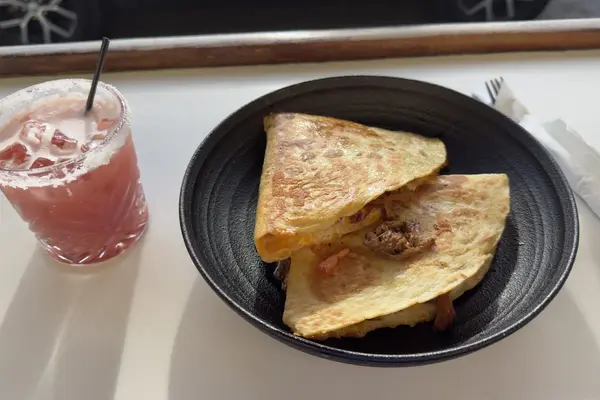 Midnight Taco: a quesadilla and a salt-rimmed drink at the counter
