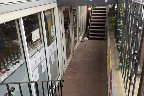 Down the steps to the basement cafe: syrup bottles in the window, dog bowls by the door