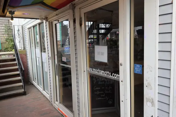Mocha Mott's door: Welcome back friends, come on in for caffeine, treats and community