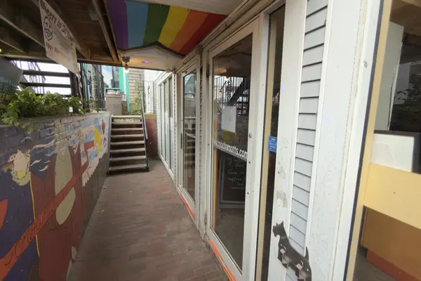 The mural and rainbow awnings on the walk to Mocha Mott's