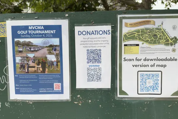 The Campground notice board: golf tournament flyer, donations and the map