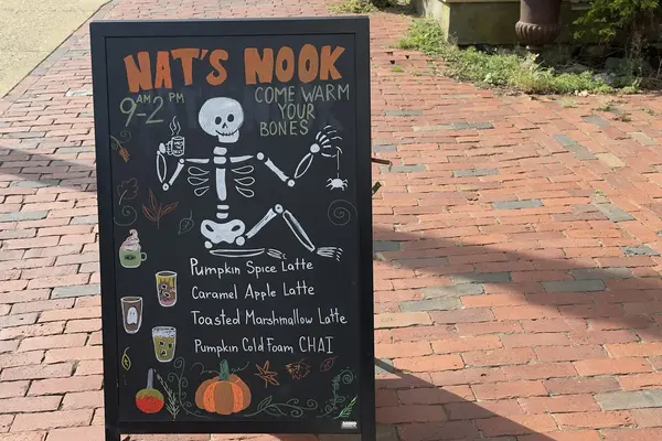 Nat's Nook fall chalkboard: pumpkin spice latte and a skeleton with a coffee