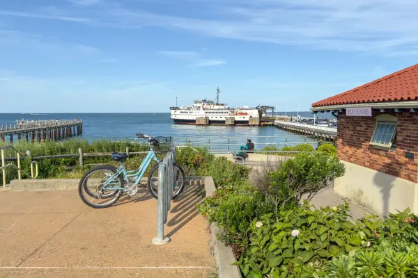 A bike, the harbor and an arriving ferry in one August frame
