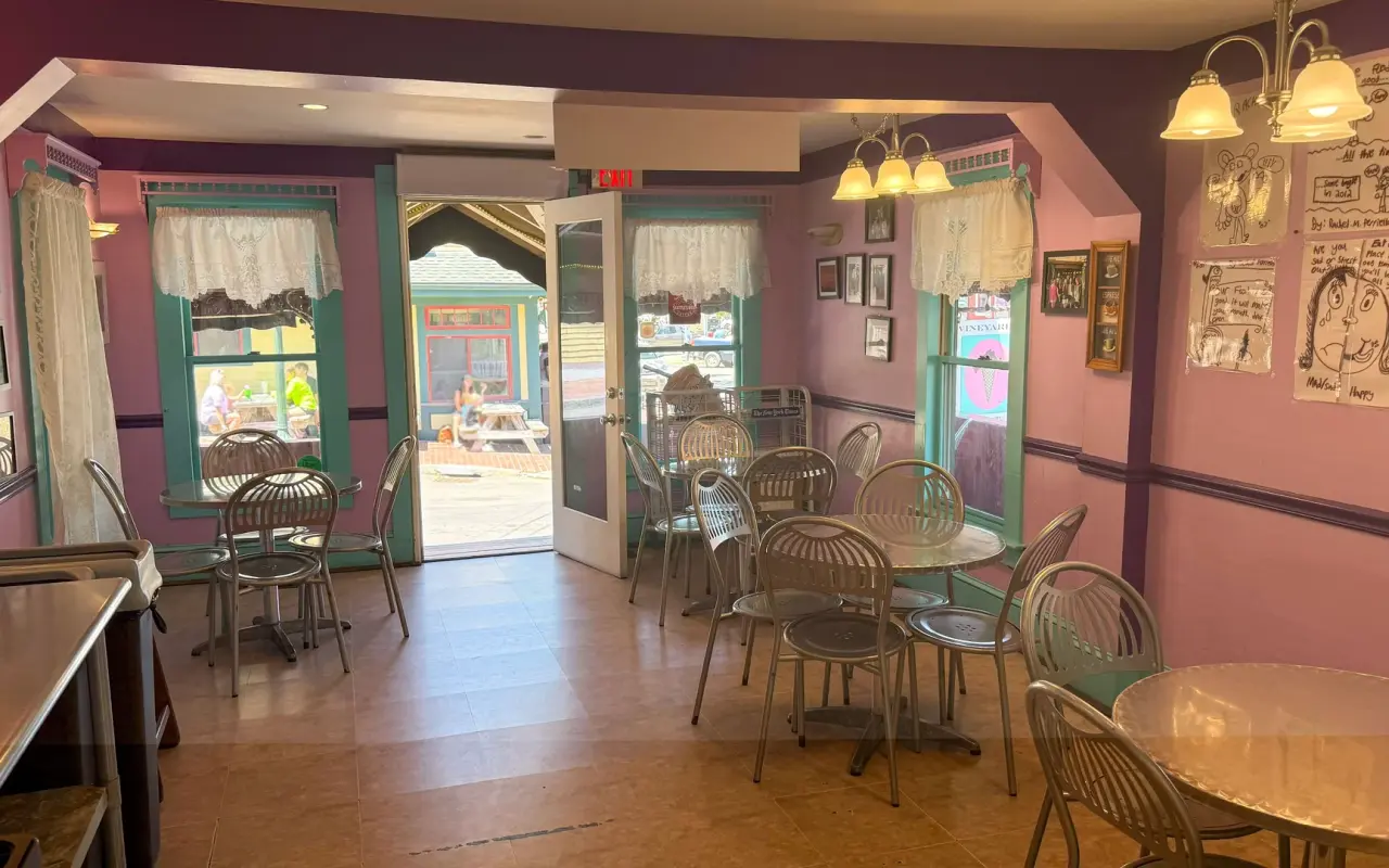 Pink parlor room with lace curtains and wire chairs inside Vineyard's Ice Cream and Coffee Co. in Oak Bluffs