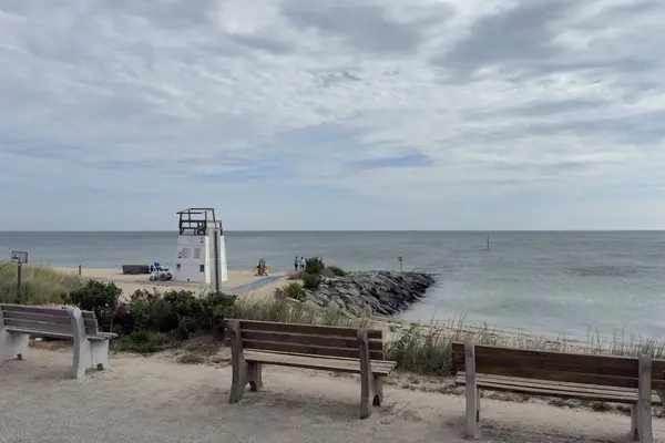 Lifeguard stand, beach wheelchairs and the jetty from the benches