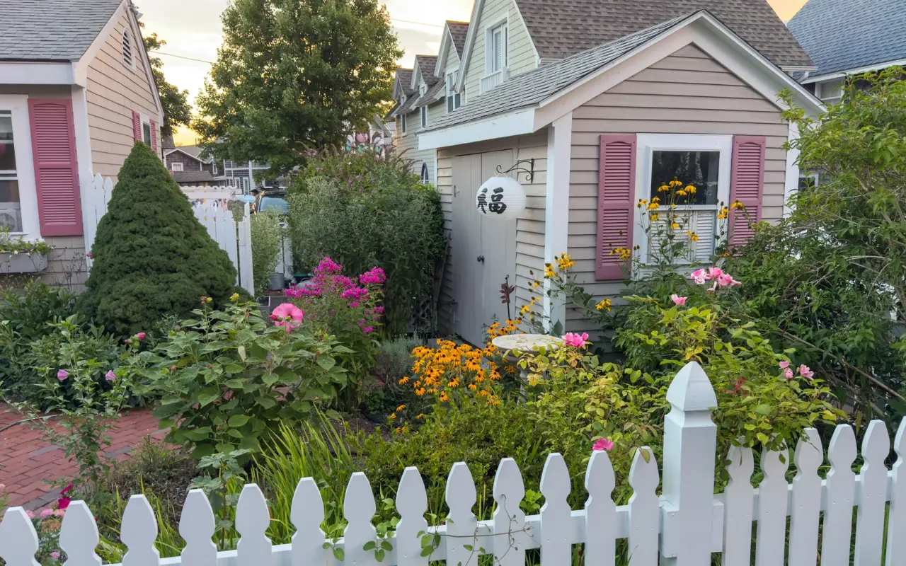 Gingerbread cottage garden with picket fence and flowers in the Oak Bluffs campground
