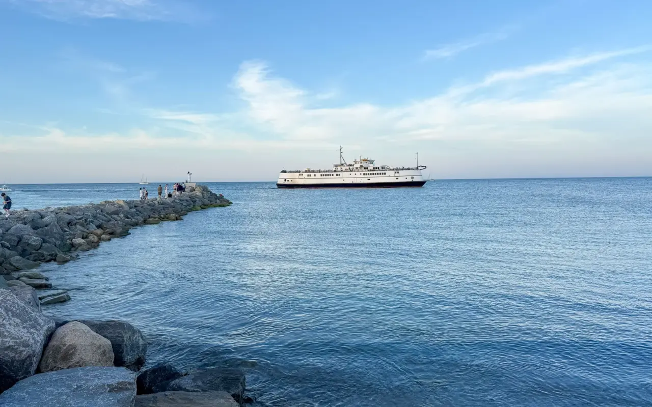 The Steamship ferry easing past the stone jetty into Oak Bluffs harbor