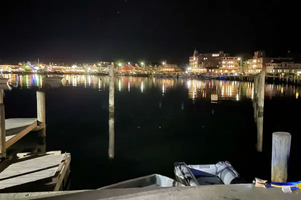 Oak Bluffs Harbor lights reflected across the water at night
