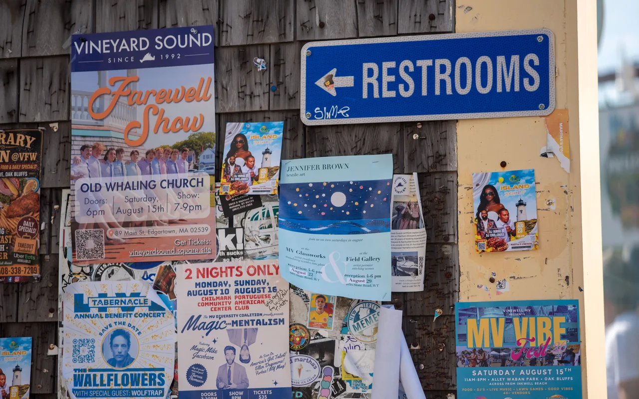 Poster wall in Oak Bluffs covered with August 2026 concert and festival posters