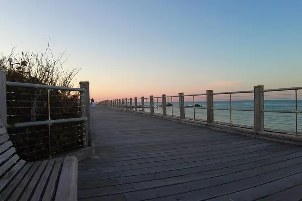 The seaside boardwalk in Oak Bluffs at dusk