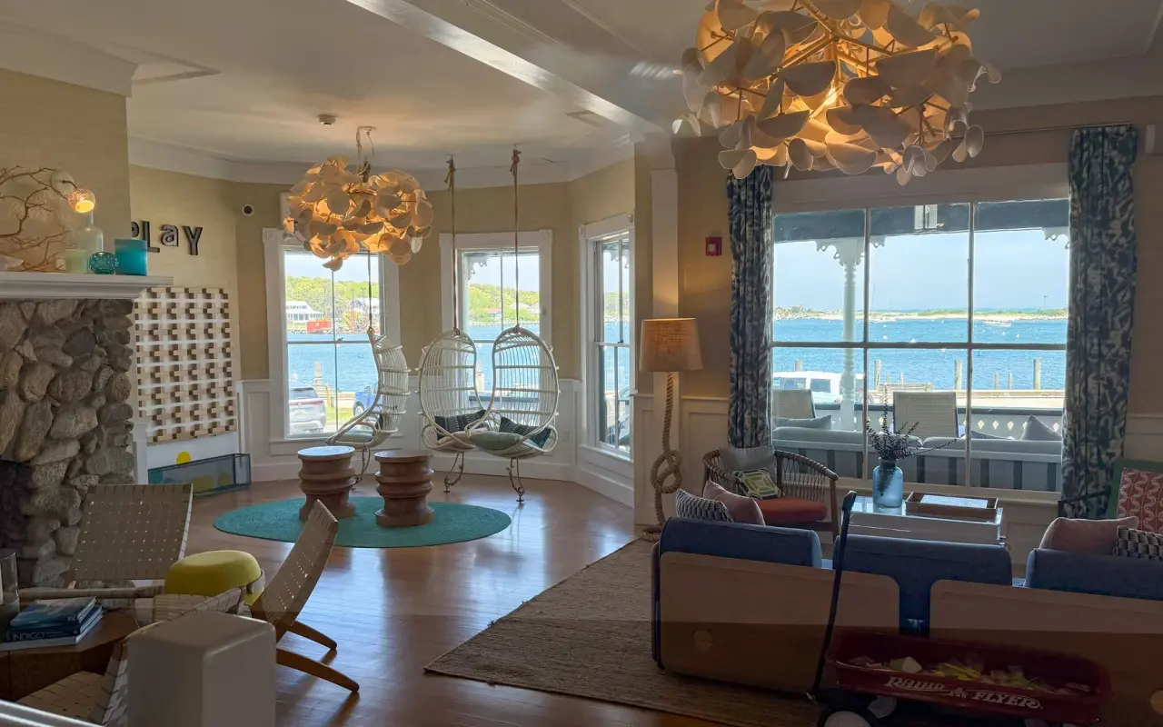 Summercamp hotel lounge with hanging chairs overlooking Oak Bluffs Harbor