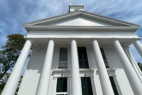 Looking up at the Old Whaling Church's columned facade