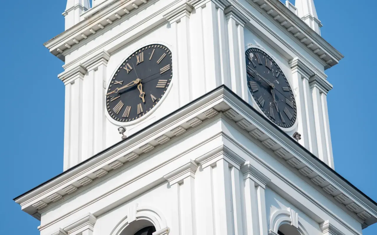 Close view of the clock faces on the tower of the Old Whaling Church