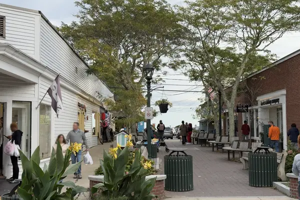 Post Office Square, Oak Bluffs: benches, canna lilies and the Back Door Donuts sign