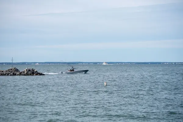 A Regulator center-console clearing the Oak Bluffs jetty, rods up