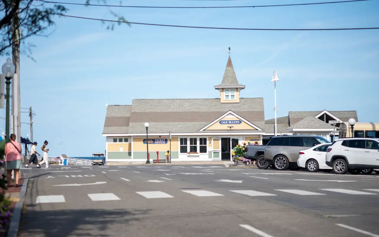 Yellow Oak Bluffs Steamship Authority ticket office with cars pulled up in front