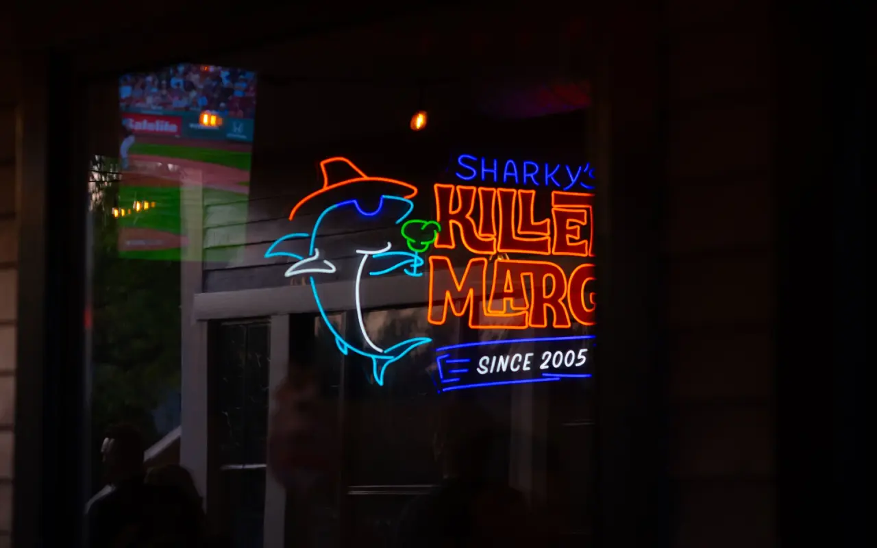 Neon Killer Margarita sign in the window of Sharkys Cantina in Oak Bluffs at night