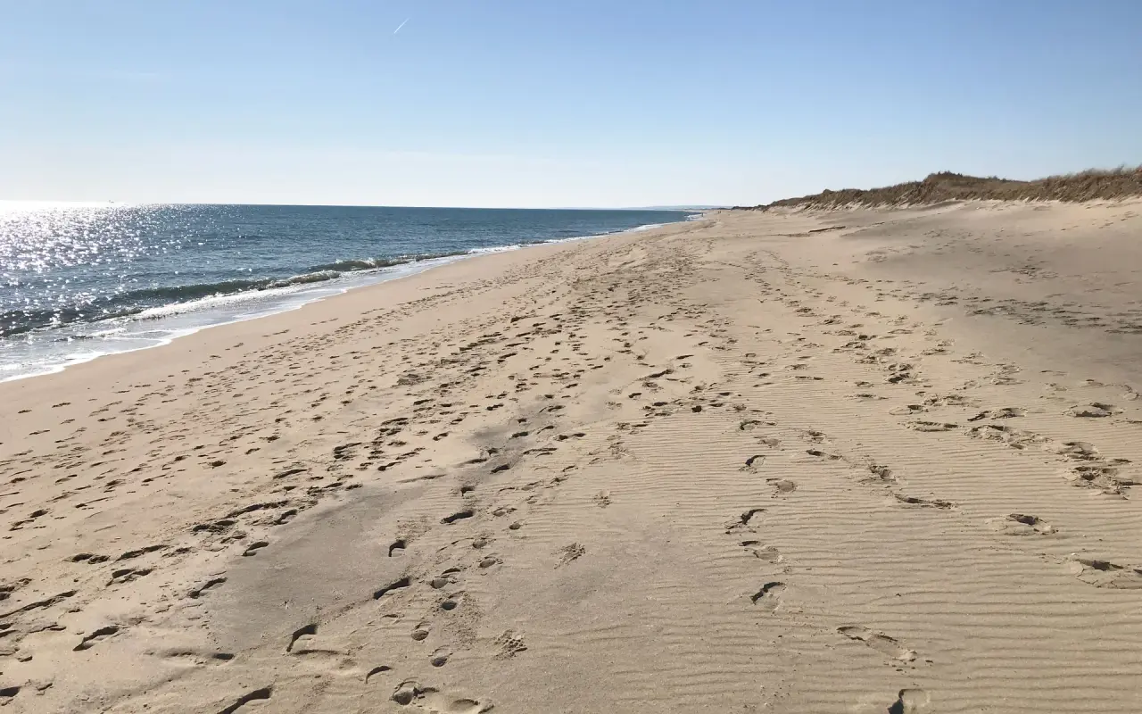 South Beach at Katama with footprints in the sand and the dunes behind