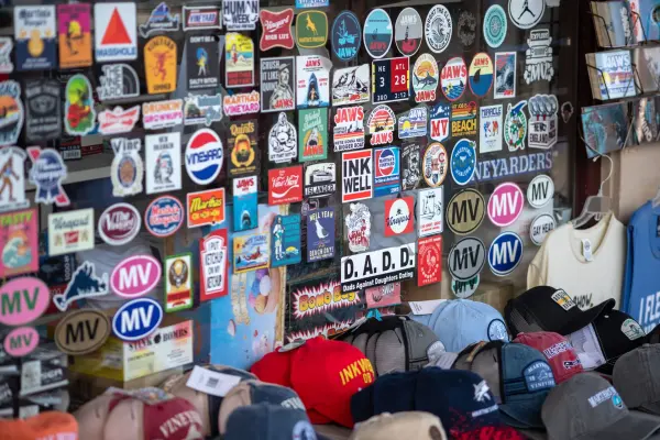 A sticker-covered store window downtown