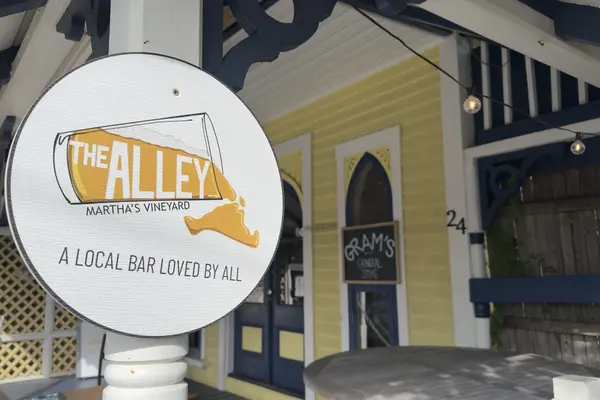 The Alley's round sign on the porch post, number 24 behind it