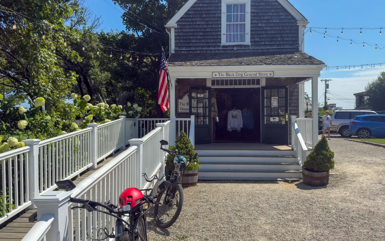 The shingled Black Dog General Store in Vineyard Haven with a bicycle parked at the porch