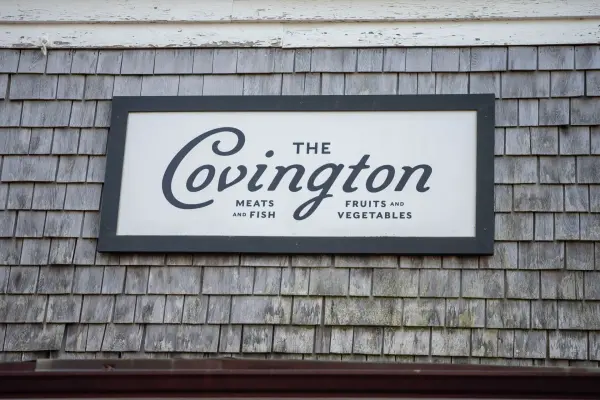 The Covington restaurant sign on cedar shingles, Edgartown