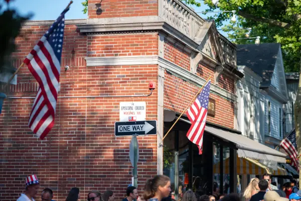 American flags on the brick corner by The Port Hunter, Main Street Edgartown, on the Fourth of July
