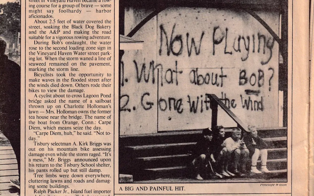 Newspaper photo of storm graffiti reading Now Playing What About Bob and Gone With the Wind after Hurricane Bob
