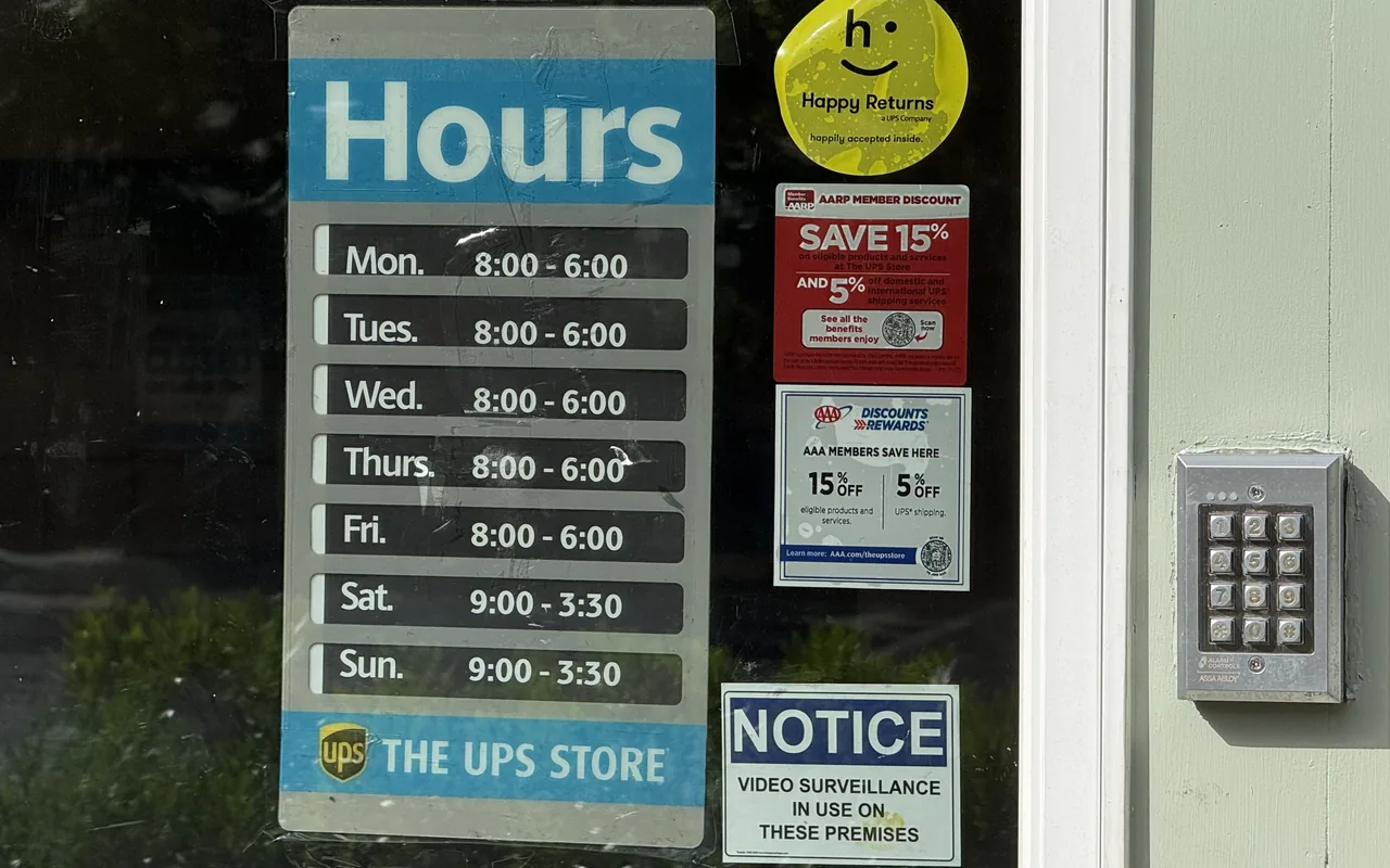 Hours sign on the door of The UPS Store in Vineyard Haven