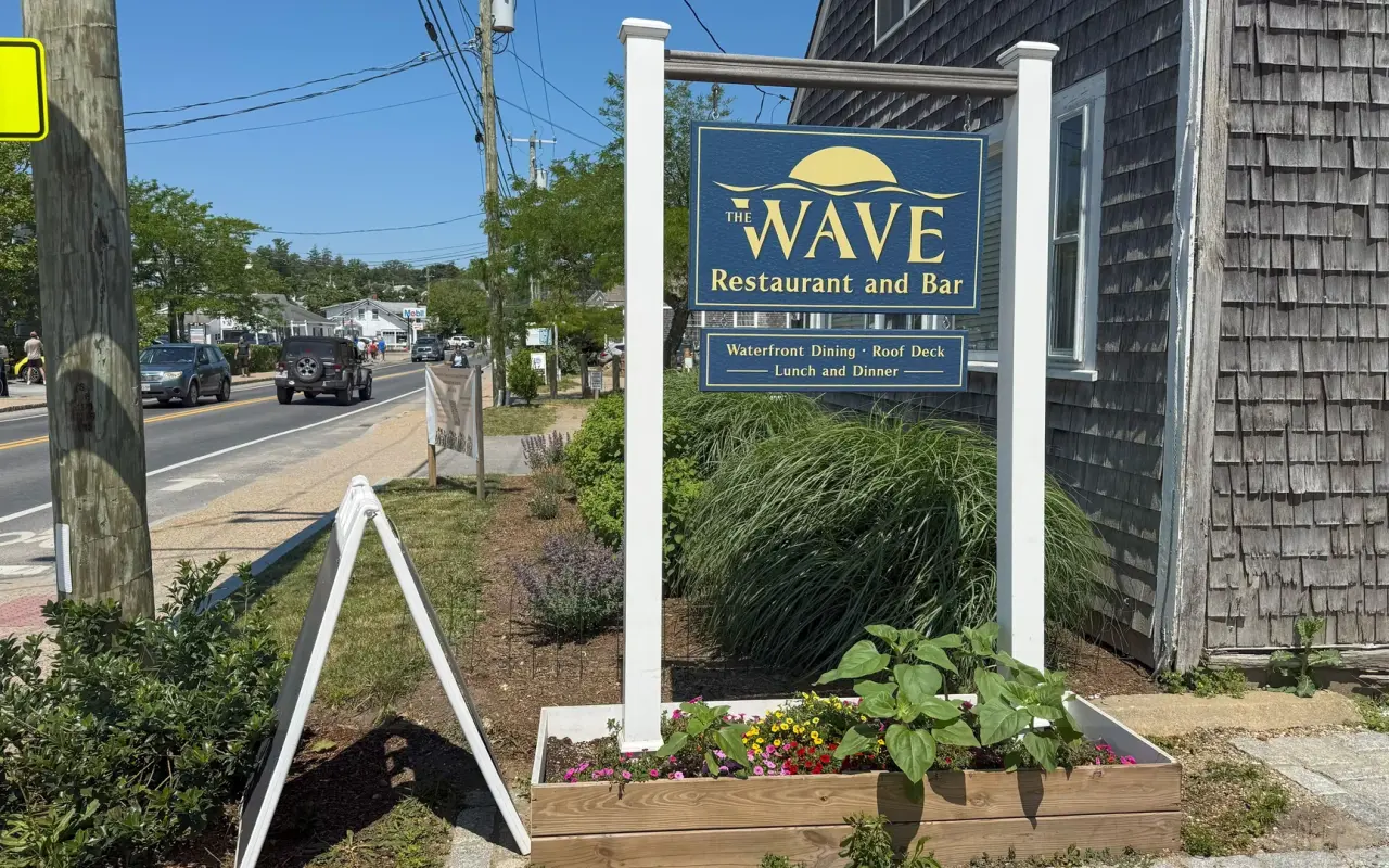 Sign for The Wave Restaurant and Bar on a post beside Beach Road in Vineyard Haven