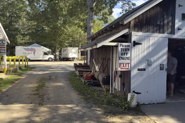 The yard at Tilton Tents and Party Rentals on Edgartown-Vineyard Haven Road: tent trucks and the tool rental barn