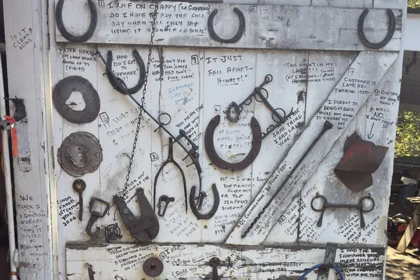 The customer question door at Tilton's tool rental barn, horseshoes and hand-written one-liners