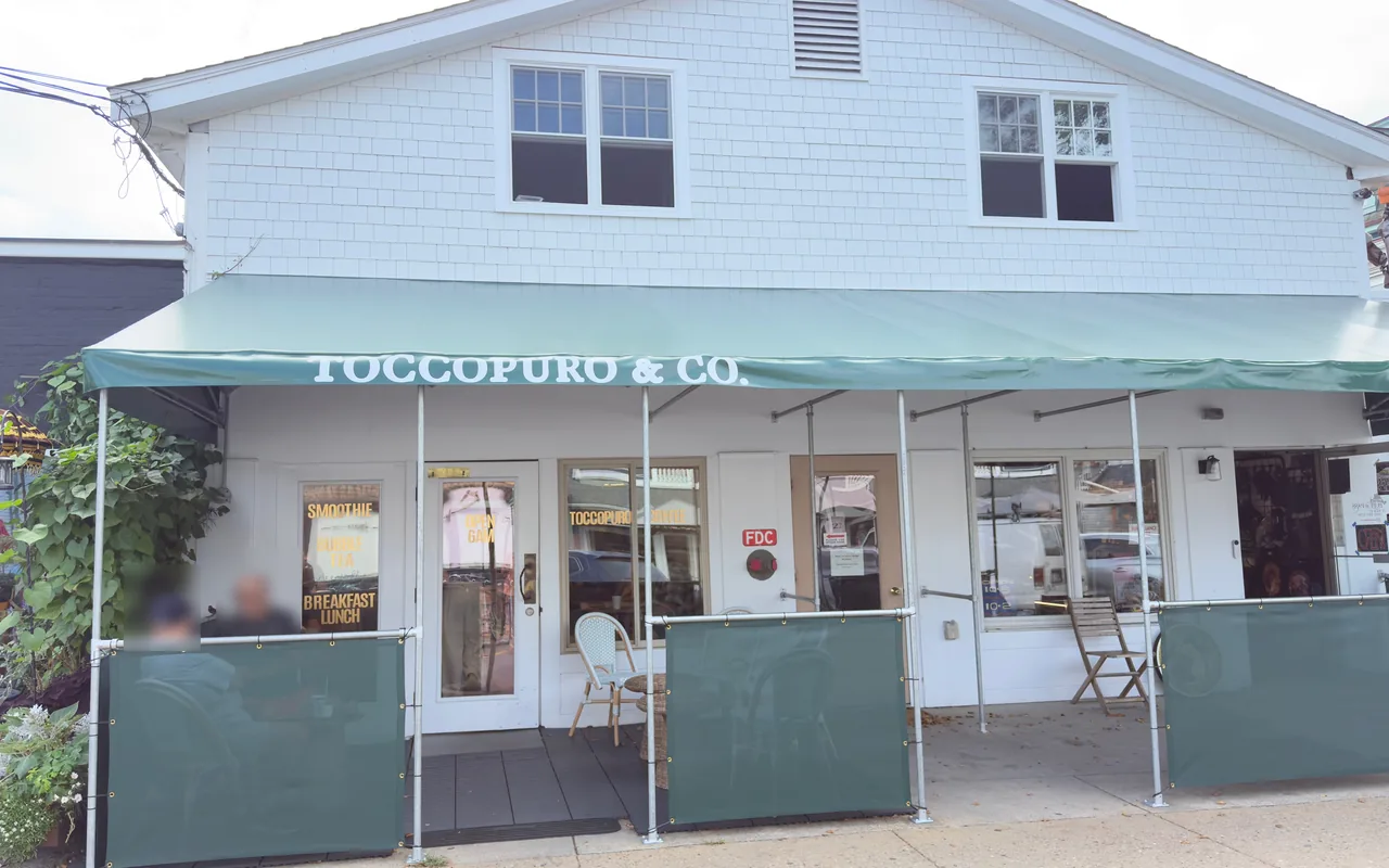 Toccopuro and Co. storefront in Vineyard Haven with Open 6AM on the door