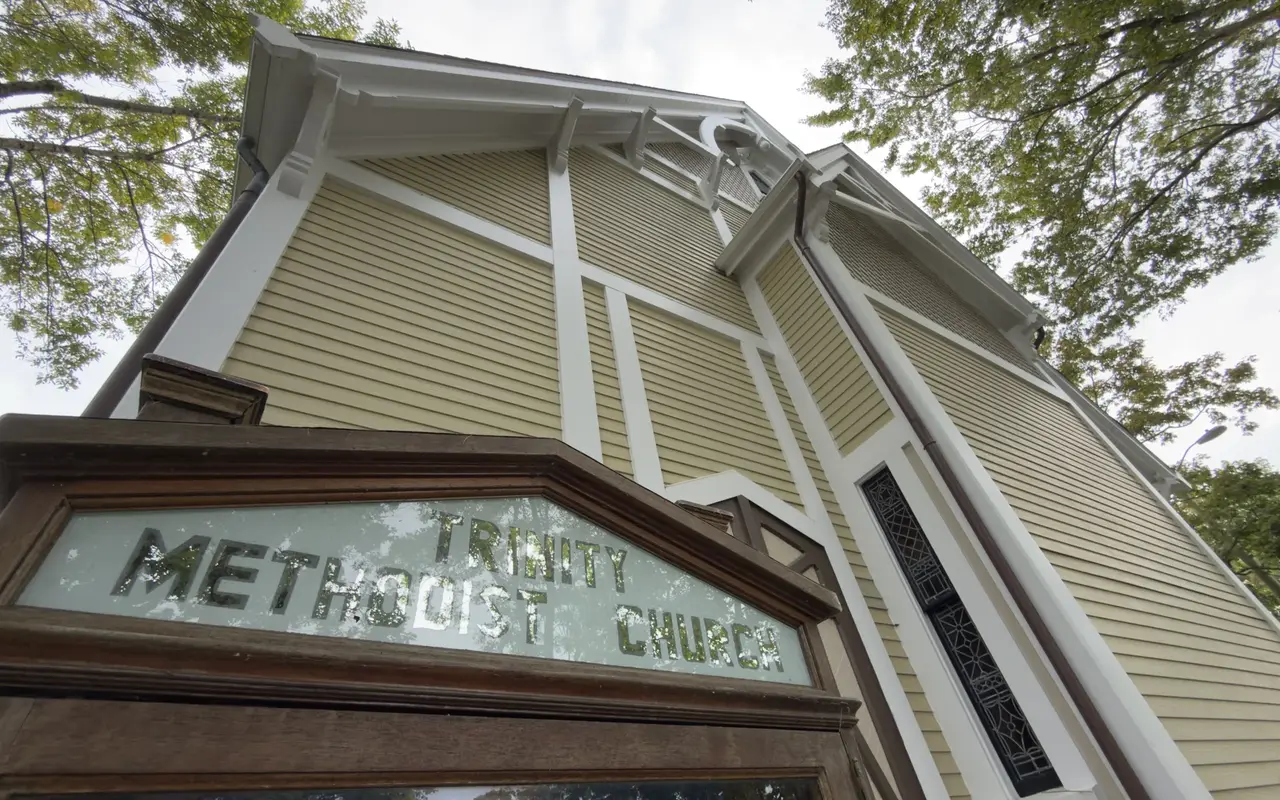 Trinity Methodist Church in the Oak Bluffs Campground seen from below its sign board