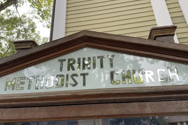 The old glass sign board at Trinity Methodist Church