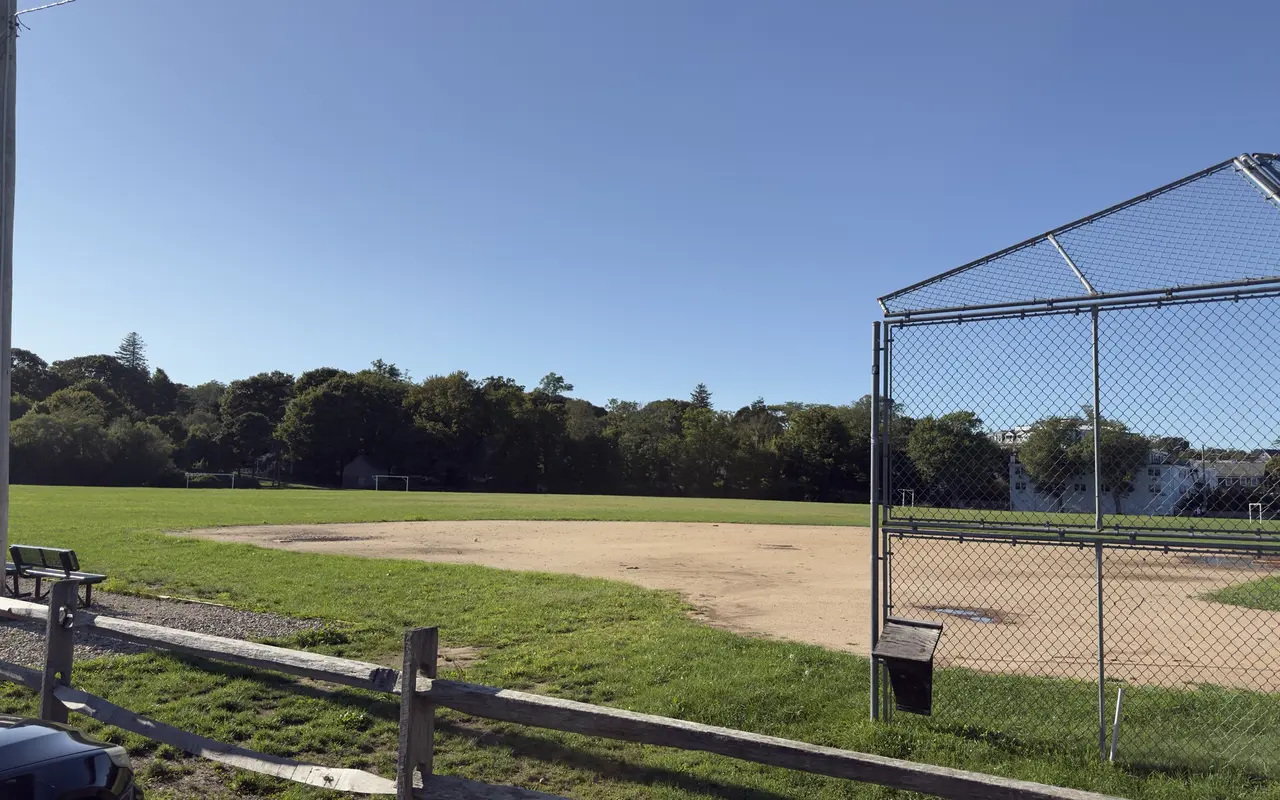 The infield, backstop and benches at Veterans Memorial Park in Vineyard Haven under a clear September sky