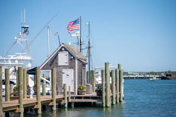 The shed at the end of the Black Dog Wharf, flags up