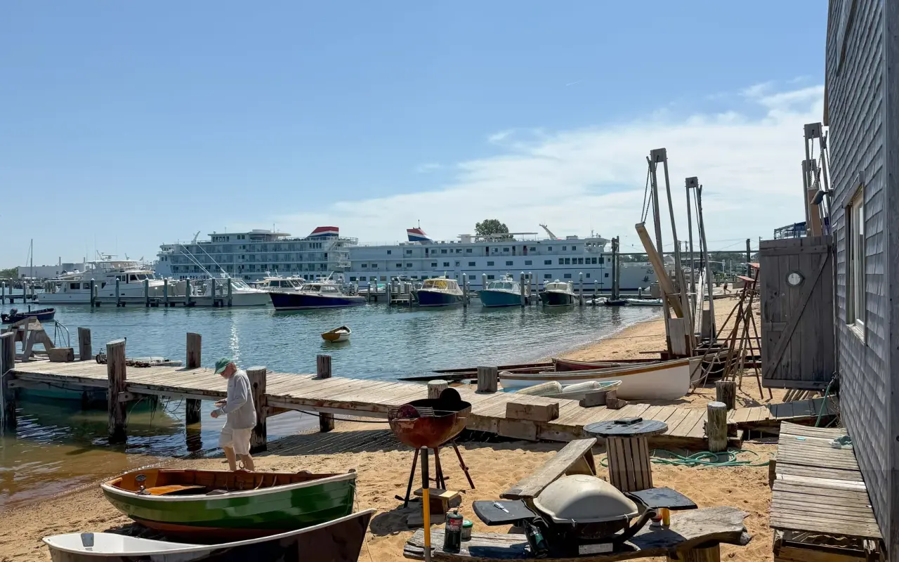 Boats in Vineyard Haven Harbor on a sunny day with the ferry dock beyond