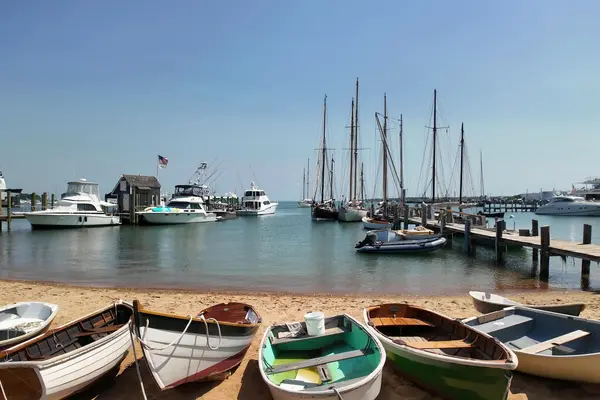 Rowing dinghies on the harbor beach
