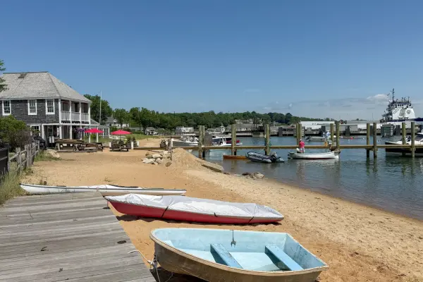 Dinghies and kayaks pulled up on the sand along Vineyard Haven Harbor