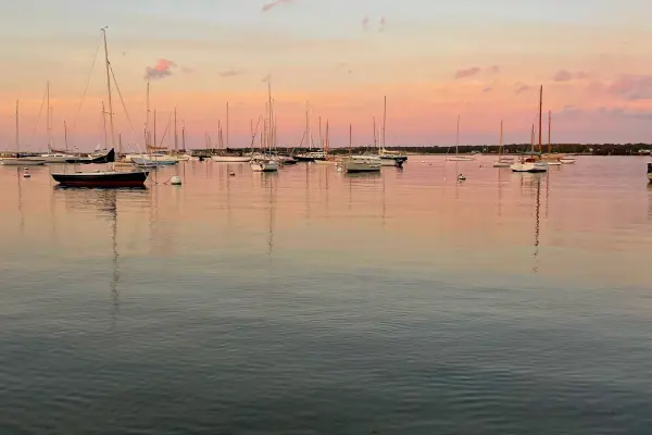 Pastel sunset over sailboats in Vineyard Haven Harbor