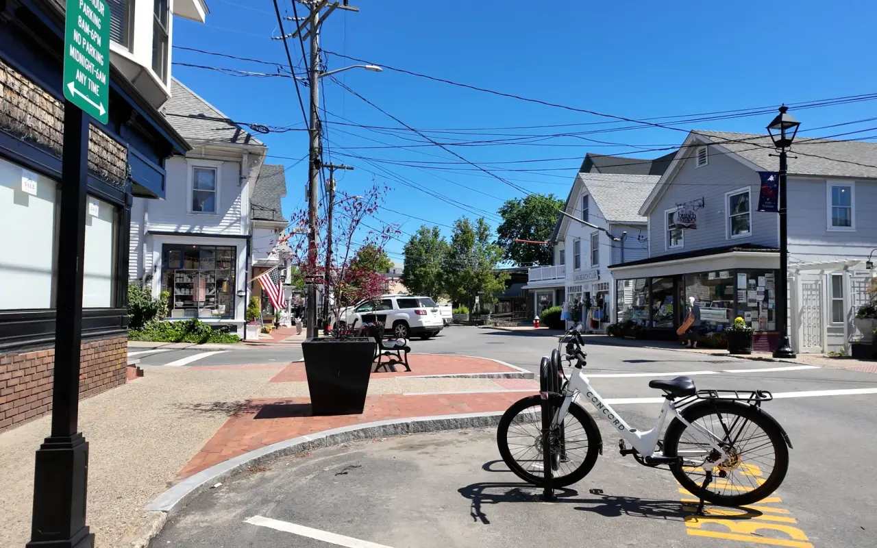 A downtown street in Vineyard Haven with shops and a parked electric bike