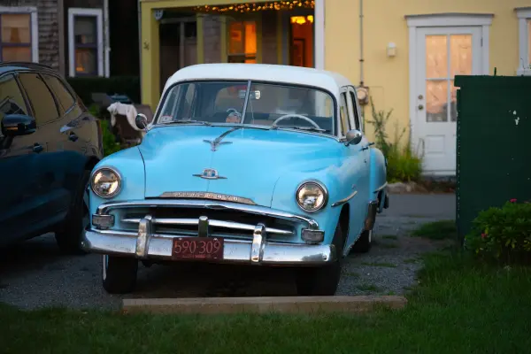 A 1950s Plymouth aging gracefully outside a campground cottage
