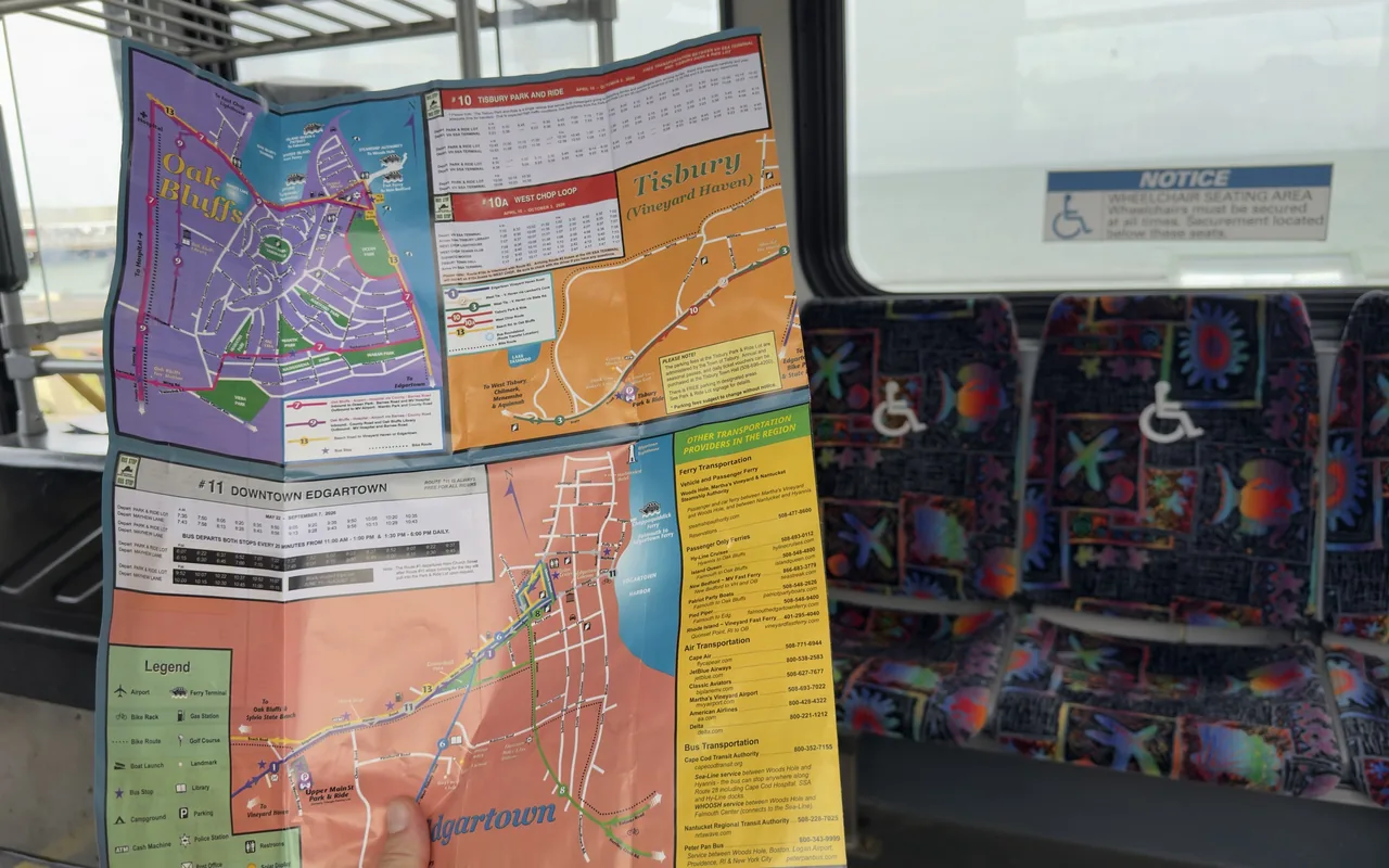 The VTA route map brochure opened inside a bus, showing the Oak Bluffs, Tisbury and Edgartown maps and the list of ferry, air and bus providers